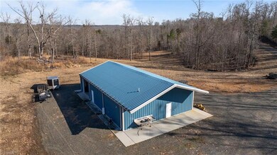 2400 sq foot insulated (R-13) Renegade steel building (built in 2016) with 3 commercial garage door entries