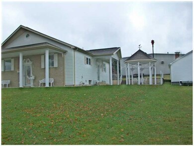Exterior Front. COVERED FRONT AND SIDE ENTRY