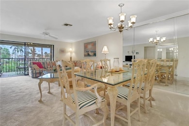 Dining area featuring ornamental molding, visible 
