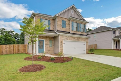 Craftsman-style home featuring a garage and a fron