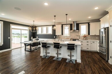 Open eat in kitchen, breakfast bar, and stainless Bosch appliances