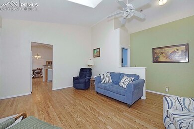 Great Room With Vaulted Ceiling And Hardwood Floor