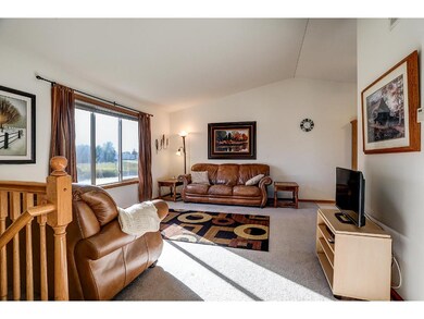 Upper level living room - great windows, vaulted c