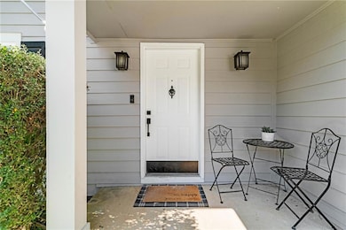 Property entrance with covered porch