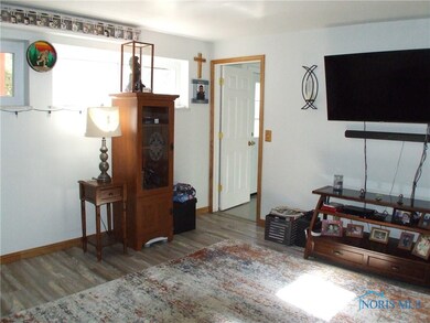 Family room showing doorway to utility room and ha