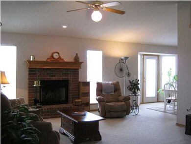 Vaulted living room with cozy fireplace