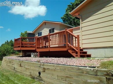 Back of home with huge deck