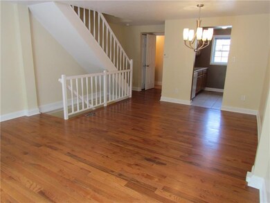 ANOTHER VIEW OF THE LIVING AND DINING ROOMS- NOTIC
