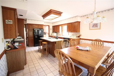 kitchen has Cherry cabinets , ceramic tile floorin