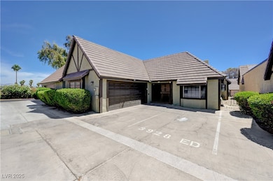 View of front of home featuring stucco siding, a t