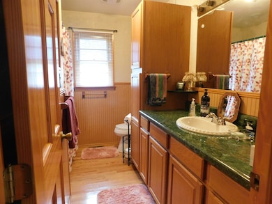 Full bath has a large vanity, extensive cabinets for storage and an over sized linen storage.