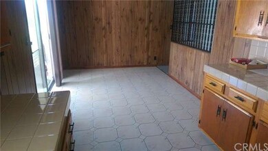 Partial View of Kitchen and door leading to side pool.
