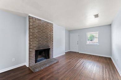 Unfurnished living room with wood finished floors