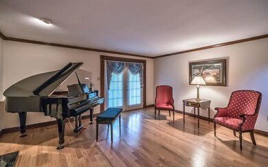 Enhanced by natural light, hardwood floors and han