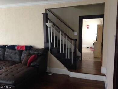View from the Spacious Living room into the Breakfast Room which has a china cabinet that stays and matches the breakfast bar unit in the kitchen.