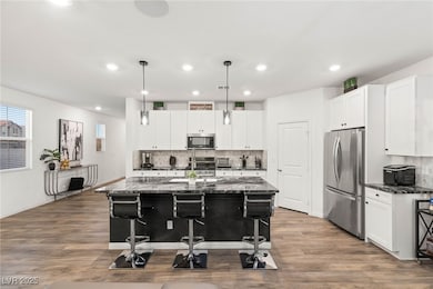 Kitchen featuring stainless steel appliances, a br