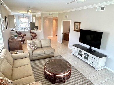 Living area with light tile patterned floors, visi