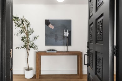 Foyer entrance featuring wood-type flooring