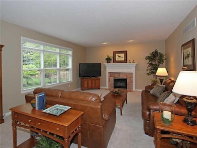 Family Room. This room is open to the kitchen just as most families desire.  Photos were taken on a cloudy day and the house is still light, bright and open!