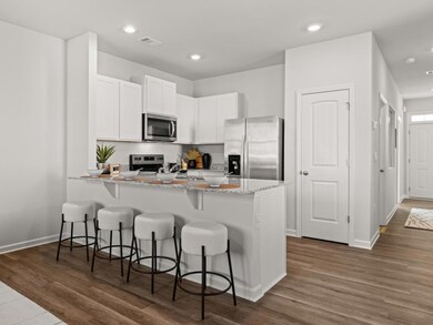 Pearson kitchen open to the living area with white