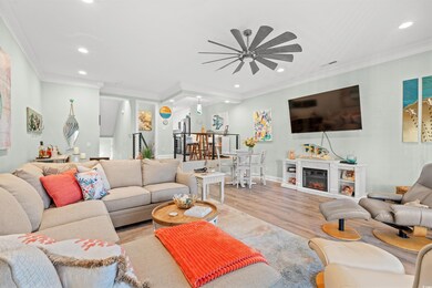 Living room with ceiling fan, light hardwood / woo