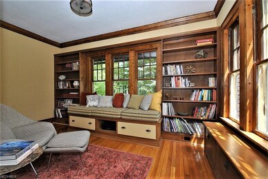 Light filled library with built ins and window sea