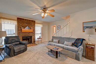 Family room with wood burning fireplace.