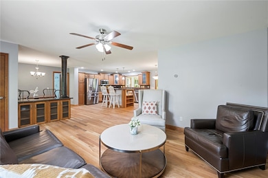 Beautiful Living Room with ceiling fan and large w
