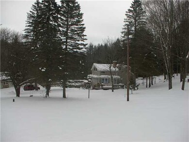 Exterior Front. Almost 5 acres of wooded land and 