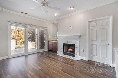 Living Room featuring a fireplace and wet bar.