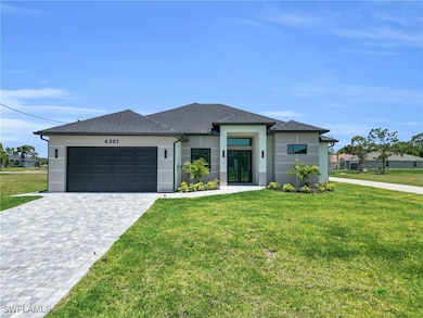 Prairie-style home with stucco siding, a front law