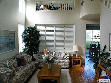 Living room with view of the loft above