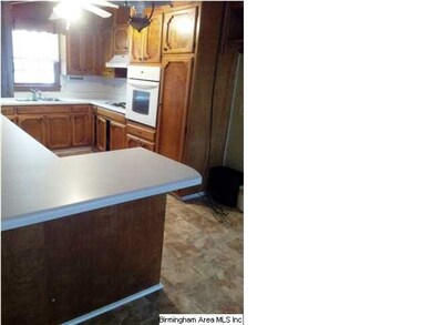 View of kitchen with lots of nice cabinetry