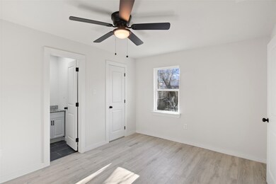 Unfurnished bedroom featuring ceiling fan, a close