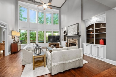 2 story family room features a wall of tinted wind