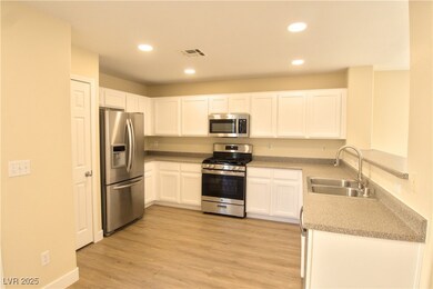 Kitchen with stainless steel appliances, recessed
