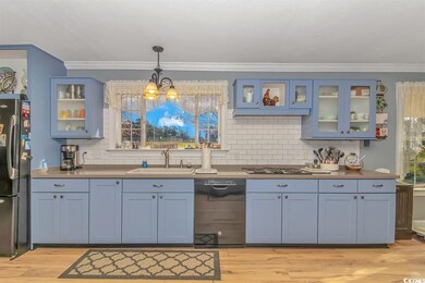 Kitchen featuring sink, appliances with stainless 