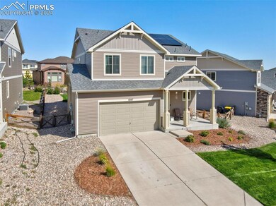 View of front of property featuring a garage