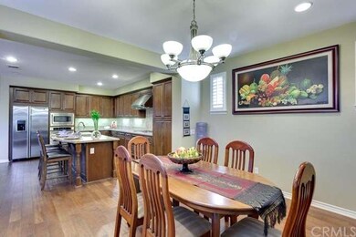 Formal dining room opens to large kitchen.