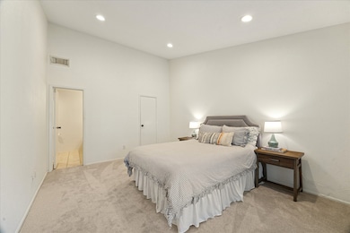 The spacious primary bedroom has new carpet (October 2025), walk-in closet and ensuite bath.