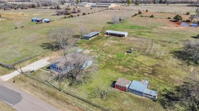 Birds eye view of property with a rural view