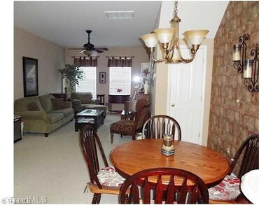 Dining Room. The open floor plan is terrific for entertaining. Ceiling fans, nice lighting and neutral carpeting make this a comfortable area to relax as well.