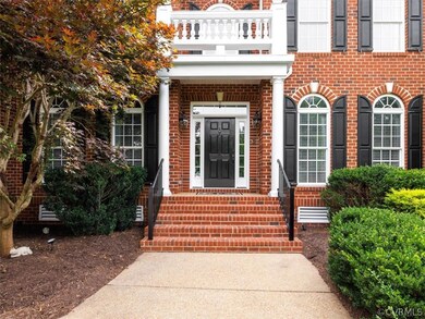 Handsome front porch with brick stairs and decorat