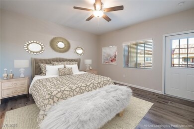 Bedroom with dark wood-type flooring, ceiling fan,