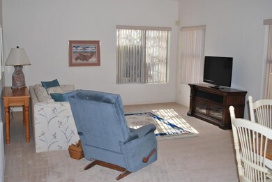 Living room opens to private patio