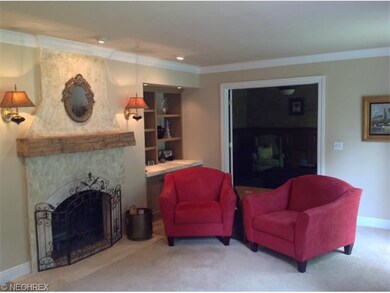 Living room with firplace, built-in shelves and vi