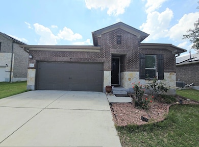 View of front of house with brick siding, concret