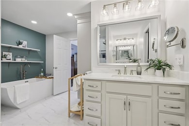 Spa-style primary bath with oversized tile shower and soaking tub