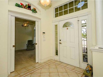 Exterior Front. Den or third bedroom just off foyer with pocket doors.