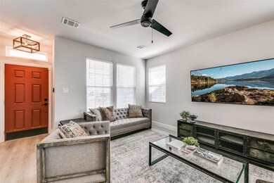 Family room is bright with window coverings, a new